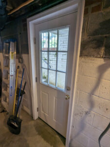 Door Replacement 05: Interior view of newly installed door with custom trim