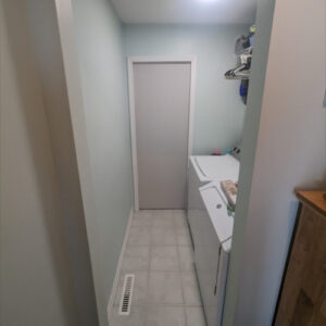 Laundry Room Renovation photo 10: Completed laundry room renovation with pocket door closed off hiding the pantry